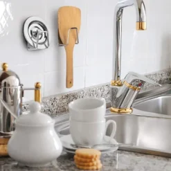 Hållare i rostfritt stål för disksvampen